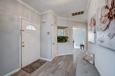 Entryway from the front door with crown molding, h