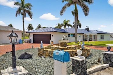 Ranch-style home featuring an attached garage, dri