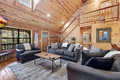 Living room featuring wooden ceiling, wood-type fl