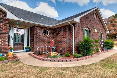 View of side of property with a lawn