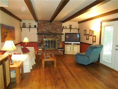 Family Room. Hard Wood Floors, Brick Fireplace, We