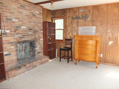 Family room has a brick fireplace.