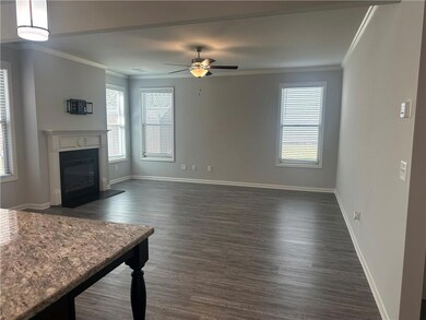 Unfurnished living room with dark wood finished fl
