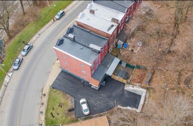 Huge lot! Includes large driveway for 5+ cars and