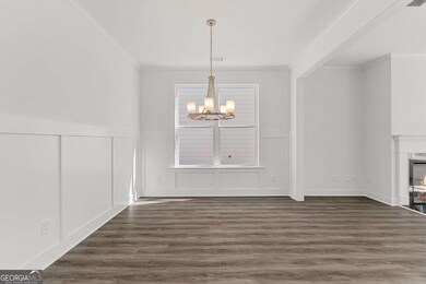 Open dining area positioned between the kitchen an