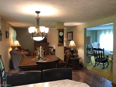 dining room, family room, kitchen, living room vie