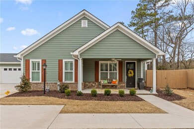 View of front of property with covered porch, an a