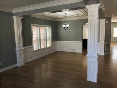 Unfurnished dining area featuring a healthy amount of sunlight, visible vents, and ornate columns