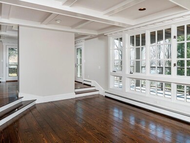 The living room has a wall of glass...