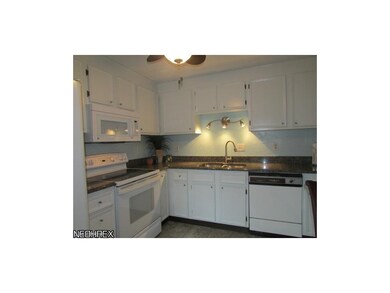 This upgraded kitchen boasts granite counter tops,