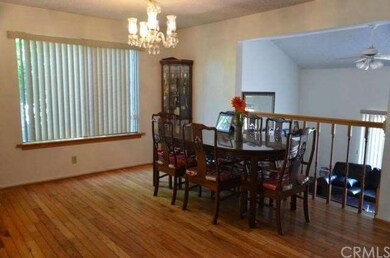 formal dining room with chandelier and hardwood floor
