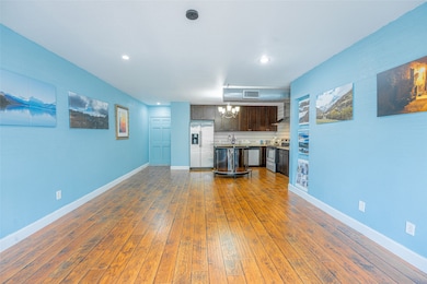 View of open floor plan of living room, dining and