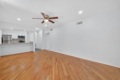 a bright, open living area with hardwood floors, r