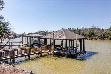 Custom covered dock with walkway, ceiling fans, TV