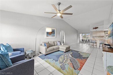 Living room featuring ceiling fan, lofted ceiling,