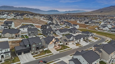 Aerial perspective of suburban area featuring a mountain backdrop