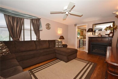 Living Room with Hardwood Floors and a Gas Firepla