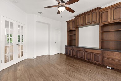 Unfurnished living room featuring french doors, o