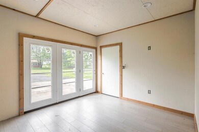 Spare room featuring light wood-style floors