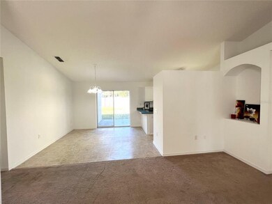 Open family room with vaulted ceilings