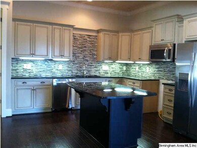 Beautiful kitchen!  Painted cabinets, glass tile b