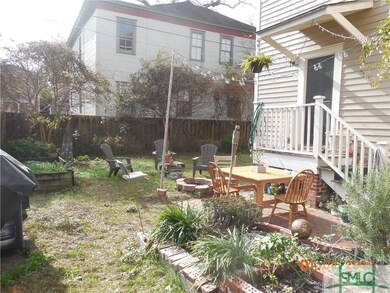 Fenced yard.  The door on right goes to the downst