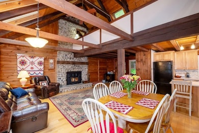 Another view of dining area/living room with expos