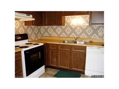 The eat-in kitchen includes a newer range, all app