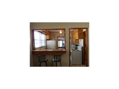 Kitchen. Breakfast bar and entrance to kitchen