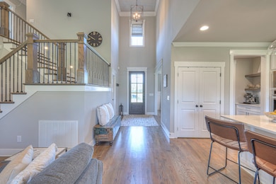 View of grand foyer with high ceiling