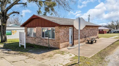 View of home's exterior with a patio, brick siding