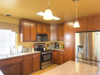 Remodeled kitchen - rich cherry cabinets...