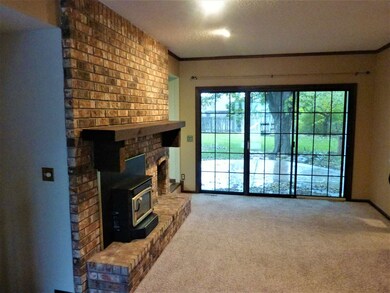 Cozy family room with wood burning fireplace