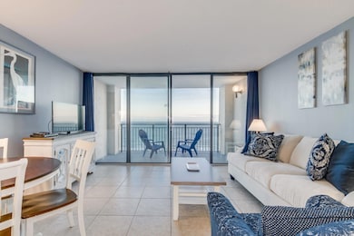 Tiled living room with expansive windows
