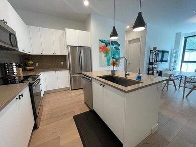 Kitchen featuring stainless steel appliances, tas