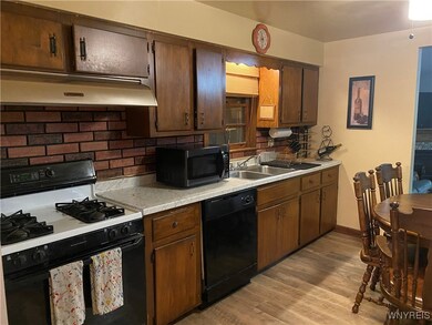 Kitchen includes oven, dishwasher, and refrigerato
