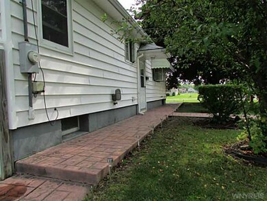 Other Side of home with stamped concrete walkway