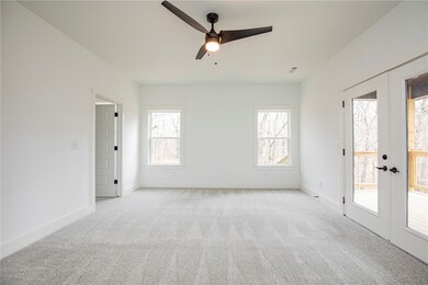 Primary bedroom with access to back deck.
