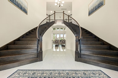 The grand double staircase makes a stunning first