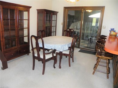 Dinette features ceiling light/fan and slider to t
