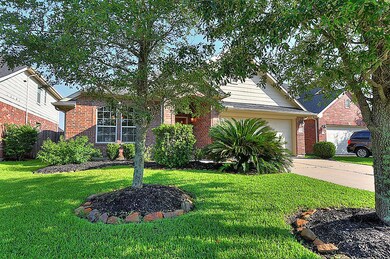 Lavish landscaping  and well manicured lawn with wonderful shady oak trees.
