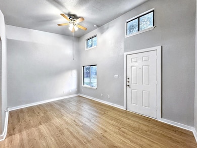 Foyer with plenty of natural light, baseboards, w