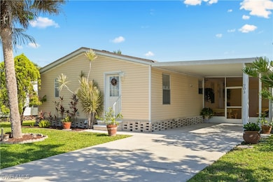 Manufactured / mobile home with concrete driveway,