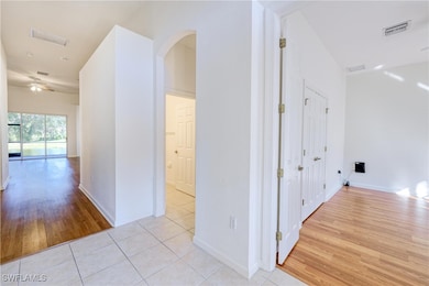 Corridor with light wood-type flooring