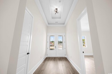 Doorway to outside with french doors, dark hardwoo