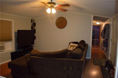 Hallway leads to 2 bedrooms and shared bathroom