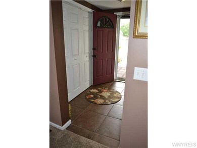 Foyer Formal entrance with tile flooring and large