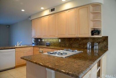Kitchen open to family room and breakfast nook wit
