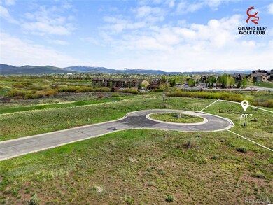 Prime golf-course exposure from Lot 7 with rolling fairways and mountain vistas defining the backdrop. Lot lines shown are approximate.