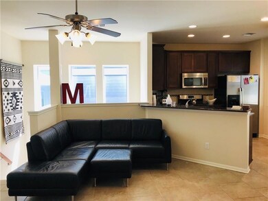 Living area featuring light tile patterned floors